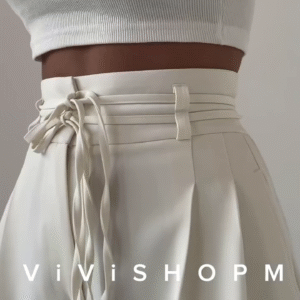 High-Waist Stone Beige Tailored Palazzo Pants with Waist-Cinch Belt Detailing – Elegant Pleated Wide-Leg Trousers for Modern Minimalist Fashion