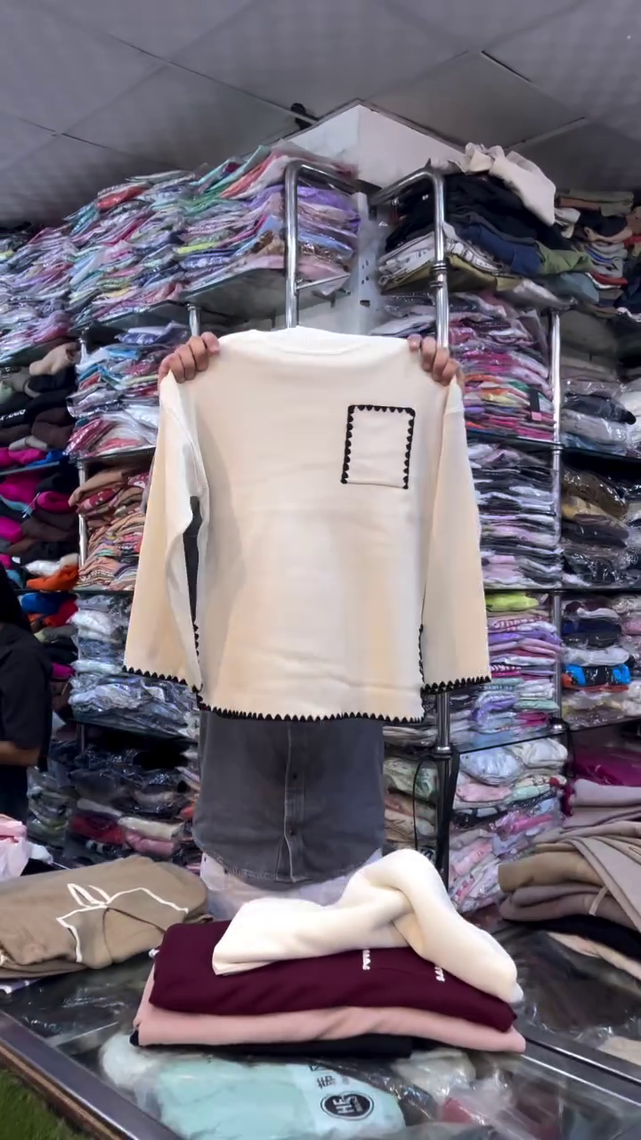 🧵 "Minimalist Modern Café Cream Knit Top with Artistic Black Scalloped Accents and Pocket Detail for Everyday Sophistication Seekers" 🧵