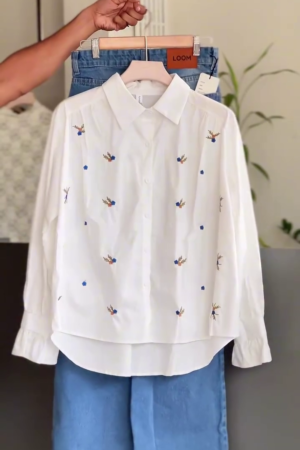 🕊️✨ Delicate White Embroidered Swallow Bird Shirt with Blue & Coral Accents Paired with Light Blue Wide-Leg Jeans - Whimsical Feminine Chic for Spring Casual & Effortless Elegance! 👗💙👖