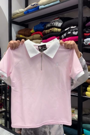 Casual Pastel Pink Short-Sleeve Polo Shirt Featuring a Contrast White Collar, Metallic Quarter-Zipper, and Ribbed Sleeve Cuffs π€