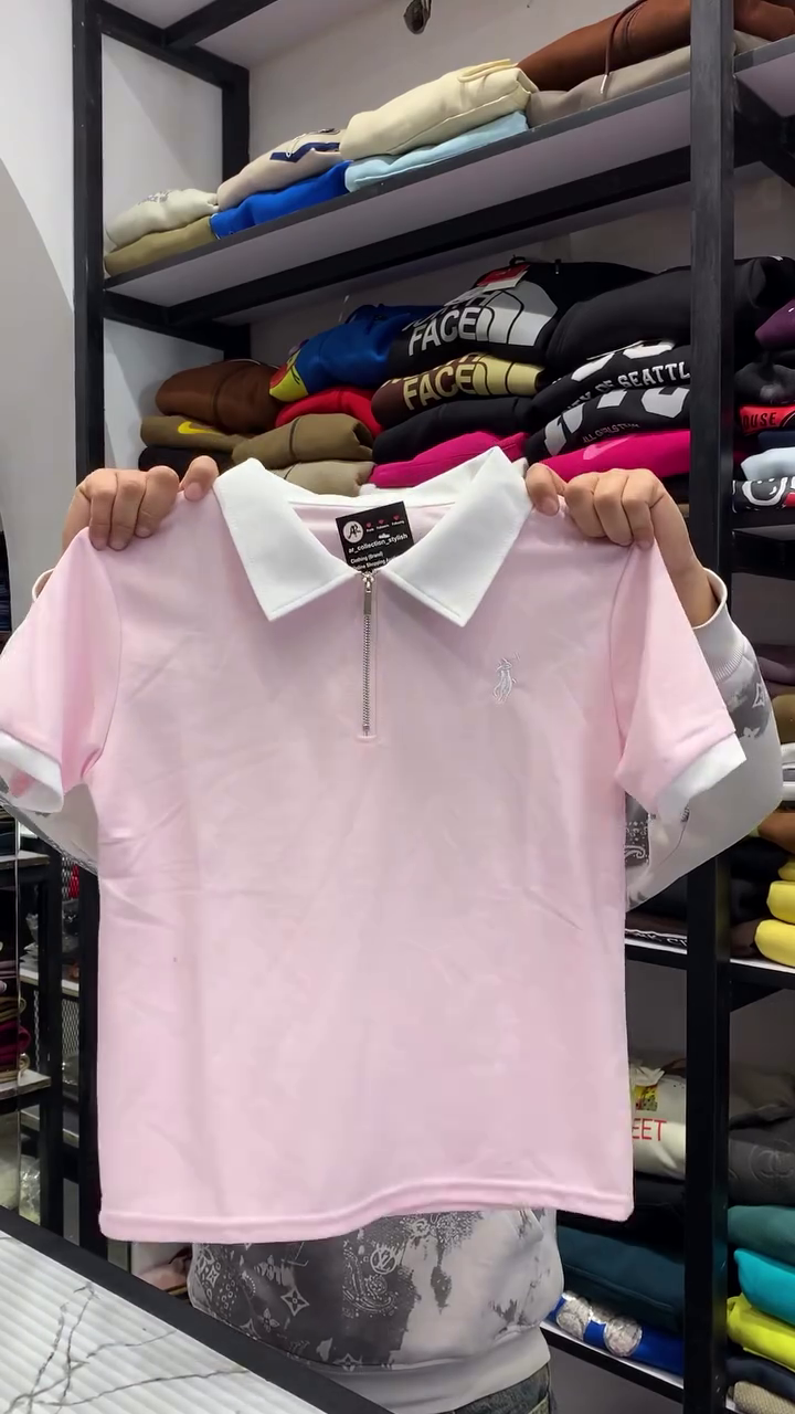 Casual Pastel Pink Short-Sleeve Polo Shirt Featuring a Contrast White Collar, Metallic Quarter-Zipper, and Ribbed Sleeve Cuffs 🤍